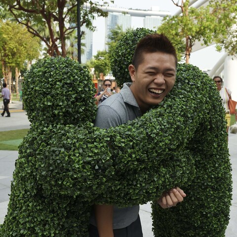 The Human Hedges giving hedge hugs at a festival in Singapore.
